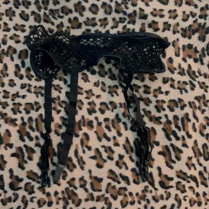 Fishnet garter belt. Pinup boudoir